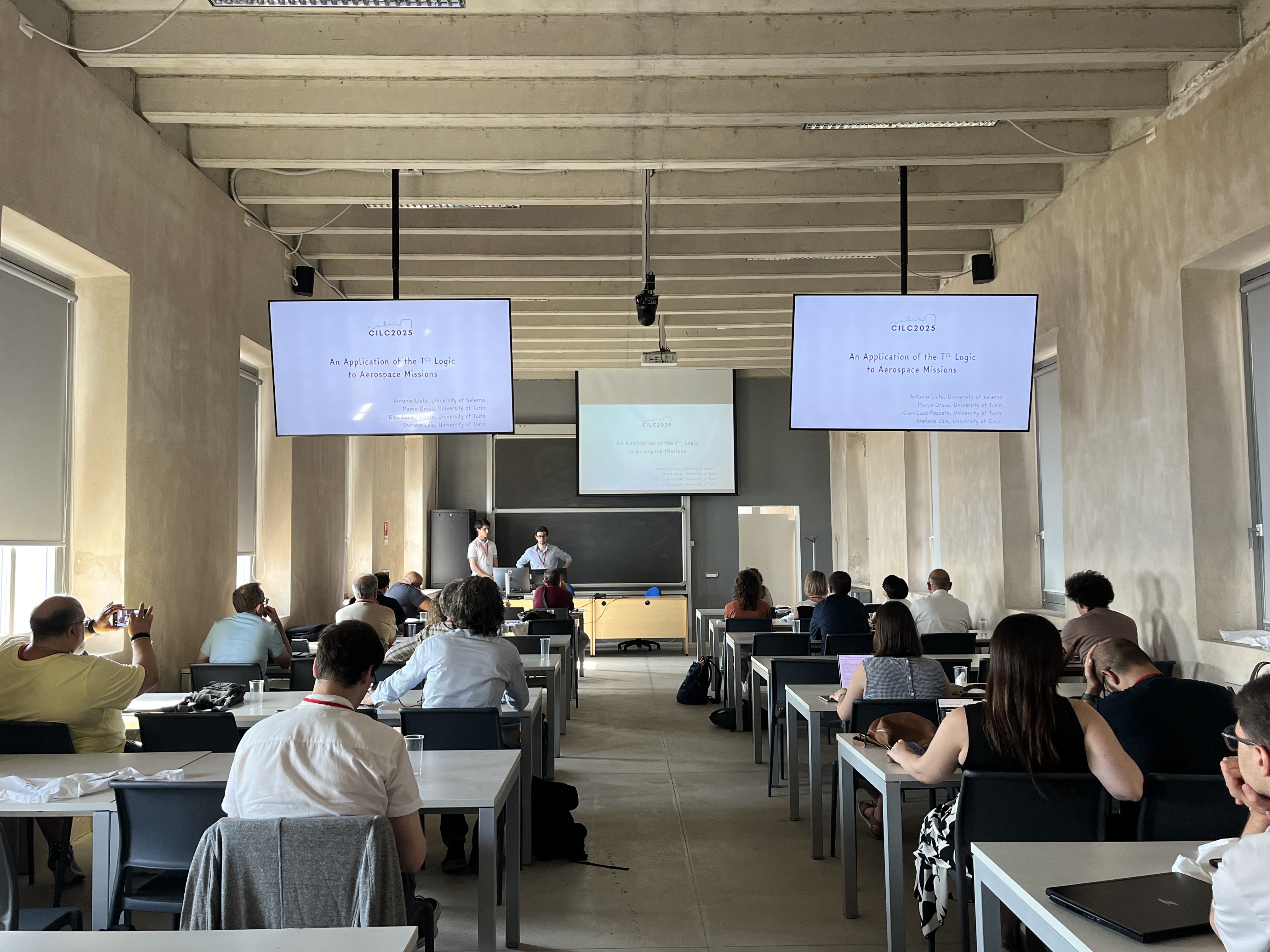Marco Orusa and Stefano Zoia presenting at CILC 2025